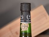 a bottle of beer that is sitting on a table