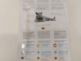 a close up of a bag of cat food on a table