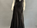 an image of a mannequin wearing a black evening dress