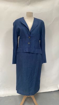 blue suit on a mannequin stand against a white backdrop