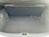 a trunk of a car with the back seats folded down