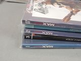 three dvds stacked on top of each other on a table