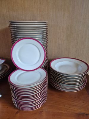 a lot of plates that are stacked on a table