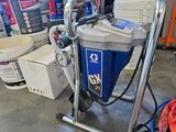 a vacuum that is sitting on a cart in the garage