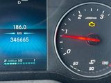 a close up of a car dashboard with a speedometer