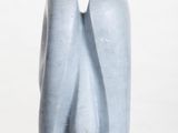 a blue sculpture on a white pedestal with a white background