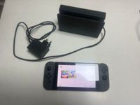 Une NINTENDO Switch avec son doc (démarre). (photo 2)