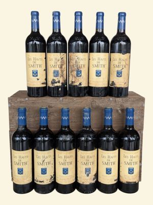 six bottles of red wine sit in a wooden crate