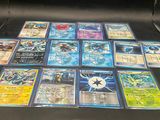 a laptop that has a lot of pokemon cards on it