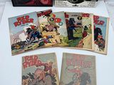 une pile de bandes dessinées posée sur une table blanche