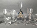 a lot of wine glasses that are sitting on a table