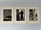 three framed pictures of a man in a black robe and a woman in a white dress