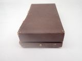 a piece of chocolate sitting on top of a white table