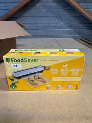 a box of food sitting on the floor next to a box of food