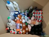 a cardboard box filled with bottles and bottles of water