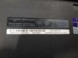 a close up of a label on the back of a laptop