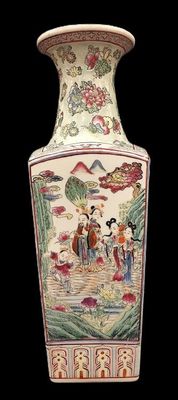 a vase with a painting on it sitting on a table