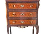 an image of a small chest of drawers on a white background