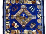 une photo d'un foulard carré bleu sur lequel figure une image de ville