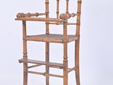 a wooden high chair with a wooden seat on a white background