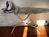 a ironing board and a shoe on a ironing board