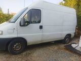 a white van that is parked on the side of the road