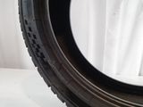 a close up of a tire tire on a white surface
