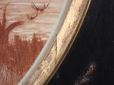 a picture of a painting of a deer in a field