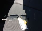 a picture of a pair of car keys in the back seat of a car