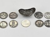 a close up of a coin and a small bowl on a table