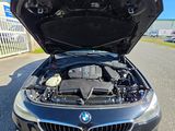 the engine of a bmw car with its hood open