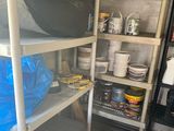 a room with a shelf full of items and a blue bag
