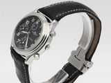 a close up of a wrist watch with a black leather strap