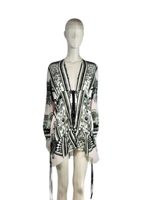 a mannequin wearing a black and white dress with a black and white pattern