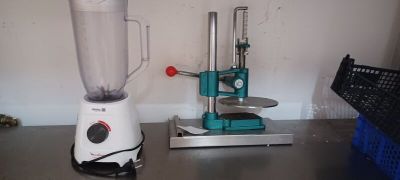 a blender that is sitting on a table next to a basket