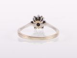 a close up of a ring with a flower design on it
