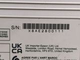 a label on the back of a white refrigerator