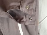 a close up of a jacket with buttons on it