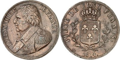 a silver coin with a crown on top of it