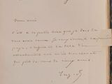 a close up of a book with a handwritten letter on it