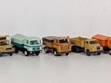 a lot of small toy horses lined up in a row