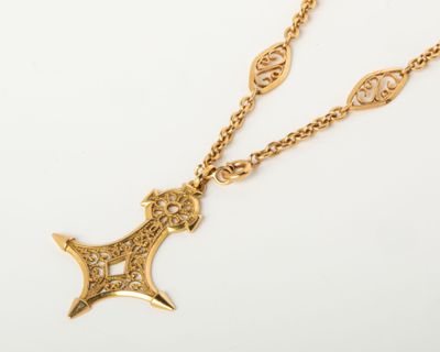 an image of a gold necklace with a cross on it