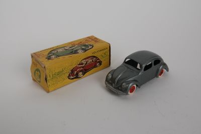 an image of a toy car and a box on a white surface