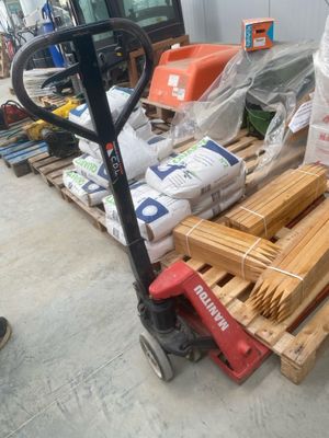 a pallet full of wood sitting on a pallet in a warehouse