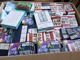 a cardboard box filled with books and other items