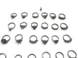 an image of a bunch of rings sitting on top of a white surface