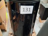 a trash can with a sticker on it sitting on a pallet