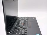 a laptop with a black keyboard on a white surface