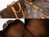 a close up of a louis vuitton bag with a zipper open