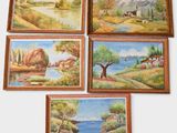 four framed paintings of a landscape with a river, a house, and a boat